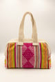 Cartera de mano de lana de oveja con rombos fucsia y asas crema
